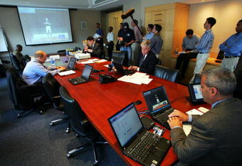 NEW YORK - JUNE 7:  Frank Marcos (R), Director of the Scouting Bureau, and Roy Krasik (Center-R), Senior Director of Major League Baseball Operations, and other individuals conduct the Major League Baseball draft on June 7, 2005 at the Major League Baseball offices in New York City. The draft was conducted via conference call.  (Photo by Ezra Shaw/Getty Images)