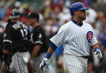 CHICAGO - JUNE 17: Geovany Soto #18 of the Chicago Cubs walks back to the dugout after making the last out against the Chicago White Sox on June 17, 2009 at Wrigley Field in Chicago, Illinois. The White Sox defeated the Cubs 4-1. (Photo by Jonathan Daniel/Getty Images)