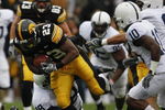 IOWA CITY, IOWA - NOVEMBER 8: Shonn Greene #23 of the Iowa Hawkeyes rushes for yards as Philip Welch #18 of the Penn State Nittany Lions tackles him as his teammates Lydell Sargeant #10 and Mark Rubin #9 watch on in the third quarter of play at Kinnick Stadium on November 8, 2008 in Iowa City, Iowa. Iowa defeated Penn State  24-23. (Photo by David Purdy/Getty Images)
