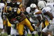 IOWA CITY, IOWA - NOVEMBER 8: Shonn Greene #23 of the Iowa Hawkeyes rushes for yards as Philip Welch #18 of the Penn State Nittany Lions tackles him as his teammates Lydell Sargeant #10 and Mark Rubin #9 watch on in the third quarter of play at Kinnick Stadium on November 8, 2008 in Iowa City, Iowa. Iowa defeated Penn State 24-23. (Photo by David Purdy/Getty Images)