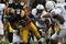 IOWA CITY, IOWA - NOVEMBER 8: Shonn Greene #23 of the Iowa Hawkeyes rushes for yards as Philip Welch #18 of the Penn State Nittany Lions tackles him as his teammates Lydell Sargeant #10 and Mark Rubin #9 watch on in the third quarter of play at Kinnick Stadium on November 8, 2008 in Iowa City, Iowa. Iowa defeated Penn State  24-23. (Photo by David Purdy/Getty Images)