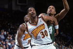 18 Feb 2000: Billy Owens #30 of the Golden State Warriors guards Tony Battie #4 of the Boston Celtics at the Oakland Coliseum in Oakland, California. The Warriors defeated the Celtics 122-100.    Mandatory Credit: Jed Jacobsohn  /Allsport