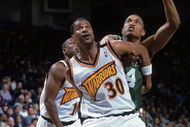 18 Feb 2000: Billy Owens #30 of the Golden State Warriors guards Tony Battie #4 of the Boston Celtics at the Oakland Coliseum in Oakland, California. The Warriors defeated the Celtics 122-100.    Mandatory Credit: Jed Jacobsohn  /Allsport