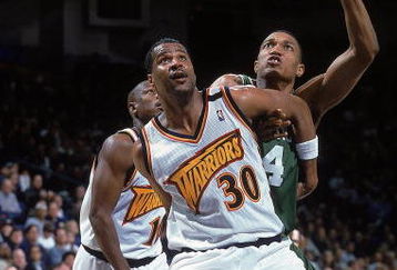 18 Feb 2000: Billy Owens #30 of the Golden State Warriors guards Tony Battie #4 of the Boston Celtics at the Oakland Coliseum in Oakland, California. The Warriors defeated the Celtics 122-100.    Mandatory Credit: Jed Jacobsohn  /Allsport