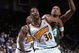 18 Feb 2000: Billy Owens #30 of the Golden State Warriors guards Tony Battie #4 of the Boston Celtics at the Oakland Coliseum in Oakland, California. The Warriors defeated the Celtics 122-100.    Mandatory Credit: Jed Jacobsohn  /Allsport