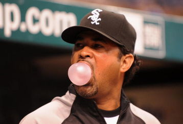 ST. PETERSBURG, FL - APRIL 16: Manager Ozzie Guillen #13 of the  Chicago White Sox blows a bubble against the Tampa Bay Rays on April 16, 2009 at Tropicana Field in St. Petersburg, Florida.  (Photo by Al Messerschmidt/Getty Images)