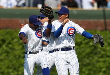 CHICAGO - MAY 29: (L-R) Alfonso Soriano #12, Reed Johnson #9 and Kosuke Fukudome #1 of the Chicago Cubs celebrate a win over the Los Angeles Dodgers on May 29, 2009 at Wrigley Field in Chicago, Illinois. The Cubs defeated the Dodgers 2-1. (Photo by Jonathan Daniel/Getty Images)