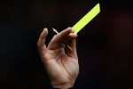 MIDDLESBROUGH, ENGLAND - APRIL 11:  Referee Phil Dowd awards a yellow card to Andrew Taylor of Middlesbrough during the Barclays Premier League match between Middlesbrough and Hull City at the Riverside Stadium on April 11, 2009 in Middlesbrough, England  (Photo by Matthew Lewis/Getty Images)