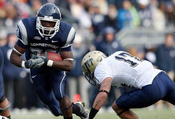 EAST HARTFORD, CT - DECEMBER 06:  Jordan Todman #23 of the Connecticut Huskies carries the ball as Aaron Berry #17 of the Pittsburgh Panthers defends on December 6, 2008 at Rentschler Field in East Hartford, Connecticut.  (Photo by Elsa/Getty Images)