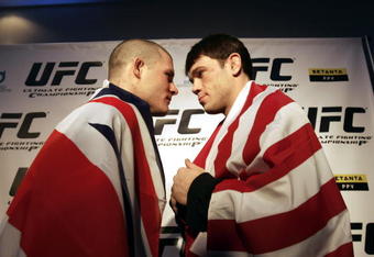 MANCHESTER, UNITED KINGDOM - FEBRUARY 23:  British Ultimate Fighting Champion Michael Bisping (L) and US fighter Forrest Griffin pose for photographs during the photocall to announce the arrival of Ultimate Fighting Championship bouts in the UK. 23 February, 2007, Manchester, England. Ultimate fighting, a mixture of martial arts is claimed to be one of the world's fastest growing sports and the largest championship in Britain is to be staged at Manchester's MEN arena on 21st April.  (Photo by Christopher Furlong/Getty Images)