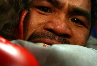 LAS VEGAS - MAY 02:  Manny Pacquiao of the Philippines hugs promoter Bob Arum after knocking out Ricky Hatton of England in the second round during their junior welterweight title fight at the MGM Grand Garden Arena May 2, 2009 in Las Vegas, Nevada.  (Photo by Al Bello/Getty Images)