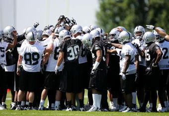 ALAMEDA, CA - MAY 08:  The Oakland Raiders huddle together during the Raiders minicamp at the team's permanent training facility on May 8, 2009 in Alameda, California.  (Photo by Ezra Shaw/Getty Images)