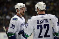 ANAHEIM, CA - MARCH 11:  Henrik Sedin #33 of the Vancouver Canucks has a word with teammate and brother Daniel Sedin #22 during a break in NHL game action against the Anaheim Ducks at Honda Center on March 11, 2009 in Anaheim, California. The Ducks defeated the Canucks 4-3 in overtime.  (Photo by Victor Decolongon/Getty Images)