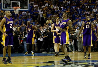 ORLANDO, FL - JUNE 14:  (L-R) Derek Fisher #2, Lamar Odom #7, Pau Gasol #16, Trevor Ariza #3 and Kobe Bryant #24 of the Los Angeles Lakers begin celebrating after defeating the Orlando Magic 99-86 in Game Five of the 2009 NBA Finals on June 14, 2009 at Amway Arena in Orlando, Florida.  NOTE TO USER:  User expressly acknowledges and agrees that, by downloading and or using this photograph, User is consenting to the terms and conditions of the Getty Images License Agreement.  (Photo by Elsa/Getty Images)