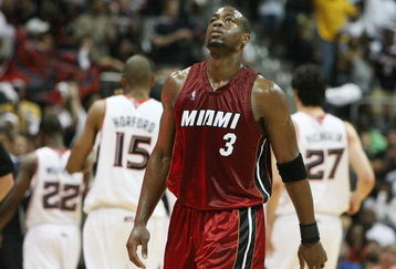 ATLANTA - MAY 03:  Dwyane Wade #3 of the Miami Heat reacts as he leaves the court during a timeout while taking on the Atlanta Hawks during Game Seven of the Eastern Conference Quarterfinals at Philips Arena on May 3, 2009 in Atlanta, Georgia. NOTE TO USER: User expressly acknowledges and agrees that, by downloading and/or using this Photograph, user is consenting to the terms and conditions of the Getty Images License Agreement.  (Photo by Doug Benc/Getty Images)