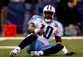 INDIANAPOLIS - DECEMBER 28:  Quarterback Vince Young #10 of the Tennessee Titans is slow to get up after taking a hit during the game against the Indianapolis Colts at Lucas Oil Stadium December 28, 2008 in Indianapolis, Indiana.  (Photo by Jamie Squire/Getty Images)