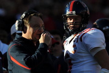 DALLAS - JANUARY 02:  Head coach Houston Nutt talks with Jevan Snead #4 of the Mississippi Rebels between downs against the Texas Tech Red Raiders during the AT&T Cotton Bowl on January 2, 2009 at the Cotton Bowl in Dallas, Texas.  (Photo by Ronald Martinez/Getty Images)