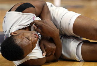 HARTFORD, CT - FEBRUARY 16:  Hasheem Thabeet #34 of the Connecticut Huskies grimaces in pain after he and DeJuan Blair #45 of the Pittsburgh Panthers collided going after a rebound on February 16, 2009 at XL Center  in Hartford, Connecticut. Thabeet was thrown to the ground on the play.  (Photo by Elsa/Getty Images)