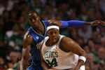 BOSTON - MAY 17:  Paul Pierce #34 of the Boston Celtics loses control of the ball as Dwight Howard #12  of the Orlando Magic defends in Game Seven of the Eastern Conference Semifinals during the 2009 NBA Playoffs at TD Banknorth Garden on May 17, 2009 in Boston, Massachusetts. The Orlando Magic defeated the Boston Celtics 101-82 to advance to the Eastern Conference Finals. NOTE TO USER: User expressly acknowledges and agrees that, by downloading and or using this photograph, User is consenting to the terms and conditions of the Getty Images License Agreement.  (Photo by Elsa/Getty Images)
