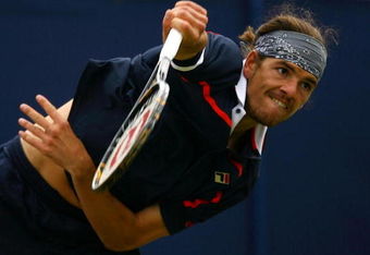 EASTBOURNE, ENGLAND - JUNE 18:  Frank Dancevic of Canada in action against Leonardo Mayer of Argentina during day four of the AEGON International on June 18, 2009 in Eastbourne, England.  (Photo by Julian Finney/Getty Images)