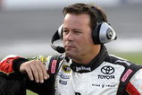 CONCORD, NC - MAY 21: Robby Gordon, driver of the #7 Jim Beam/Operation Home Front Toyota, stands on pit road during qualifying for the NASCAR Sprint Cup Series Coca-Cola 600 on May 21, 2009 at Lowe's Motor Speedway in Concord, North Carolina.  (Photo by John Harrelson/Getty Images)