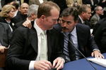 WASHINGTON - MARCH 17:  Former St. Louis Cardinal Mark McGwire (L) talks with Rafael Palmeiro of the Baltimore Orioles during a House Committe session investigating Major League Baseball's effort to eradicate steroid use on Capital Hill March 17, 2005 in Washington, DC. McGwire and Palmeiro were named in the Mitchell Report that was released December 13, 2007 by a committee looking into use of performance-enhancing drugs in Major League Baseball and headed by former Senate Majority Leader George Mitchell.  (Photo by Mark Wilson/Getty Images)