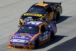 DOVER, DE - MAY 31: Jamie McMurray, driver of the #26 Crown Royal Ford leads Elliott Sadler, driver of the #19 Stanley Tools Dodge during the NASCAR Sprint Cup Series Autism Speaks 400 at Dover International Speedway on May 31, 2009 in Dover, Delaware.  (Photo by Nick Laham/Getty Images)