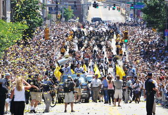 PITTSBURGH - JUNE 15:  Marc-Andre Fleury #29 and Sidney Crosby #87 of the Pittsburgh Penguins proceed down the Blvd of the Allies with the Stanley Cup during Stanley Cup Champion Victory Parade on June 15, 2009 in Pittsburgh, Pennsylvania.  (Photo by Jamie Sabau/Getty Images)