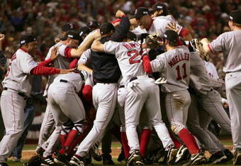 ST LOUIS - OCTOBER 27:   The Boston Red Sox celebrate on the field after defeating the St. Louis Cardinals 3-0 in game four of the World Series on October 27, 2004 at Busch Stadium in St. Louis, Missouri. (Photo by Jed Jacobsohn/Getty Images)