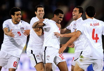 JOHANNESBURG, SOUTH AFRICA - JUNE 18:  Mohamed Homos #12 of Egypt is surrounded by his teammates as he celebrates his goal against Italy during the  FIFA Confederations Cup, between Italy and Egypt at Ellis Park Stadium on June 18, 2009 in Johannesburg, South Africa.  (Photo by Kevork Djansezian/Getty Images)