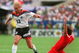 2 JUL 1994: RUDY VOELLER OF GERMANY AVOIDS THE TACKLE OF GEORGES GRUN OF BELGIUM DURING THE FIRST-HALF AT SOLDIER FIELD IN CHICAGO, ILLINOIS. VOLLER SCORED TWO GOALS AND ASSISTED ON A THIRD AS GERMANY LED BELGIUM, 3-1 AT THE HALF. Mandatory Credit: Ch