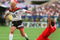 2 JUL 1994:   RUDY VOELLER OF GERMANY AVOIDS THE TACKLE OF GEORGES GRUN OF BELGIUM  DURING THE FIRST-HALF AT SOLDIER FIELD IN CHICAGO, ILLINOIS.  VOLLER SCORED TWO GOALS AND ASSISTED ON A THIRD AS GERMANY LED BELGIUM, 3-1 AT THE HALF. Mandatory Credit: Ch