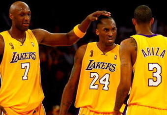 LOS ANGELES, CA - JUNE 04:  (L-R) Lamar Odom #7, Kobe Bryant #24 and Trevor Ariza #3 of the Los Angeles Lakers react in the second half against the Orlando Magic in Game One of the 2009 NBA Finals at Staples Center on June 4, 2009 in Los Angeles, California. NOTE TO USER: User expressly acknowledges and agrees that, by downloading and or using this photograph, User is consenting to the terms and conditions of the Getty Images License Agreement.  (Photo by Jeff Gross/Getty Images)