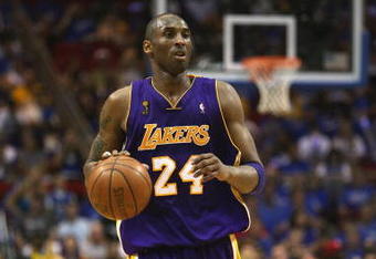 ORLANDO, FL - JUNE 14:  Kobe Bryant #24 of the Los Angeles Lakers moves the ball against the Orlando Magic in Game Five of the 2009 NBA Finals on June 14, 2009 at Amway Arena in Orlando, Florida. The Lakers won 99-86. NOTE TO USER:  User expressly acknowledges and agrees that, by downloading and or using this photograph, User is consenting to the terms and conditions of the Getty Images License Agreement. (Photo by Elsa/Getty Images) 