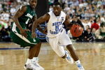 DETROIT - APRIL 06:  Ty Lawson #5 of the North Carolina Tar Heels drives on Travis Walton #5 of the Michigan State Spartans in the second half during the 2009 NCAA Division I Men's Basketball National Championship game at Ford Field on April 6, 2009 in Detroit, Michigan.  (Photo by Streeter Lecka/Getty Images)