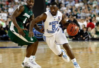 DETROIT - APRIL 06:  Ty Lawson #5 of the North Carolina Tar Heels drives on Travis Walton #5 of the Michigan State Spartans in the second half during the 2009 NCAA Division I Men's Basketball National Championship game at Ford Field on April 6, 2009 in Detroit, Michigan.  (Photo by Streeter Lecka/Getty Images)