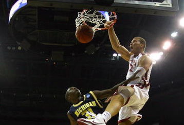 KANSAS CITY, MO - MARCH 21:  Blake Griffin #23 of the Oklahoma Sooners follows through on his slam dunk over Laval Lucas-Perry #31 of the Michigan Wolverines in the first half during the second round of the NCAA Division I Men's Basketball Tournament at the Sprint Center on March 21, 2009 in Kansas City, Missouri.  (Photo by Jamie Squire/Getty Images)