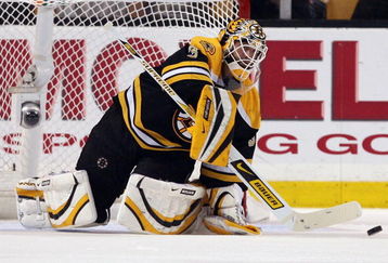 BOSTON - MAY 14:  Tim Thomas #30 of the Boston Bruins stops a shot against the Carolina Hurricanes during Game Seven of the Eastern Conference Semifinal Round of the 2009 Stanley Cup Playoffs on May 14, 2009 at the TD Banknorth Garden in Boston, Massachusetts. The Hurricanes defeated the Bruins 3-2 in overtime.  (Photo by Elsa/Getty Images)
