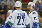 DETROIT - JANUARY 17:  The Sedin brothers Daniel #22 and Henrik #33 of the Vancouver Canucks chat prior to a faceoff in a game against the Detroit Red Wings on January 17, 2008 at the Joe Louis Arena in Detroit, Michigan. The Wings defeated the Canucks 3-2 in a shootout. (Photo by Claus Andersen/Getty Images)
