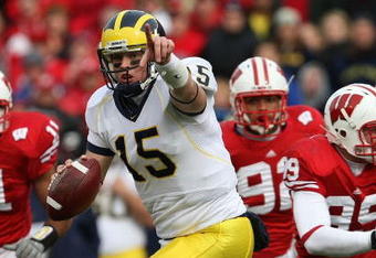 MADISON, WI - NOVEMBER 10: Ryan Mallett #15 of the Michigan Wolverines runs out of the pocket to throw a pass against the Wisconsin Badgers on November 10, 2007 at Camp Randall Stadium in Madison, Wisconsin. Wisconsin defeated Michigan 37-21. (Photo by Jonathan Daniel/Getty Images)