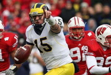 MADISON, WI - NOVEMBER 10: Ryan Mallett #15 of the Michigan Wolverines runs out of the pocket to throw a pass against the Wisconsin Badgers on November 10, 2007 at Camp Randall Stadium in Madison, Wisconsin. Wisconsin defeated Michigan 37-21. (Photo by Jonathan Daniel/Getty Images)