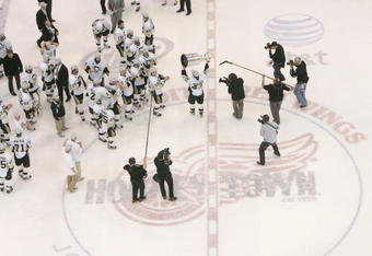 DETROIT - JUNE 12: Philippe Boucher #43 of the Pittsburgh Penguins celebrates with the Stanley Cup after defeating the Detroit Red Wings by a score of 2-1 to win Game Seven and the 2009 NHL Stanley Cup Finals at Joe Louis Arena on June 12, 2009 in Detroit, Michigan. (Photo by Bruce Bennett/Getty Images)
