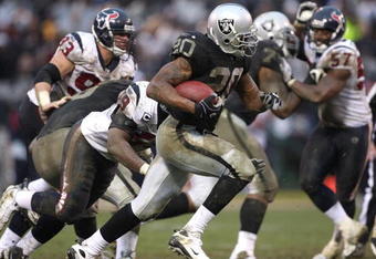 OAKLAND, CA - DECEMBER 21: Darren McFadden #20 of the Oakland Raiders runs against the Houston Texans during an NFL game on December 21, 2008 at the Oakland-Alameda County Coliseum in Oakland, California.  (Photo by Jed Jacobsohn/Getty Images)