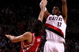 PORTLAND, OR - APRIL 28:  LaMarcus Aldridge #12 of the Portland Trail Blazers shoots against Luis Scola #4 of the Houston Rockets during Game 5 of the Western Conference Quarterfinals of the NBA Playoffs on April 28, 2009 at the Rose Garden in Portland, Oregon. NOTE TO USER: User expressly acknowledges and agrees that, by downloading and or using this Photograph, user is consenting to the terms and conditions of the Getty Images License Agreement.  (Photo by Jonathan Ferrey/Getty Images)
