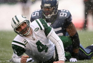SEATTLE - DECEMBER 21:  Quarterback Brett Favre #4 of the New York Jets looks up after being tackled by Lawrence Jackson #95 of the Seattle Seahawks on December 21, 2008 at Qwest Field in Seattle, Washington. The Seahawks defeated the Jets 13-3. (Photo by Otto Greule Jr/Getty Images)