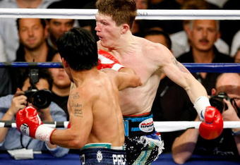 LAS VEGAS - MAY 02:  Manny Pacquiao of the Philippines hits Ricky Hatton of England during the first round of their junior welterweight title fight at the MGM Grand Garden Arena May 2, 2009 in Las Vegas, Nevada. Pacquiao defeated Hatton by a second round TKO.  (Photo by Ethan Miller/Getty Images)