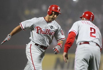 NEW YORK - JUNE 11: Raul Ibanez #29 of the Philadelphia Phillies celebrates his 3 run home run in the tenth inning with third base coach Sandy Alomar #2 against the New York Mets on June 11, 2009 at Citi Field in the Flushing neighborhood of the Queens borough of New York City. (Photo by Nick Laham/Getty Images)