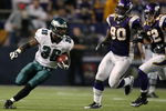 MINNEAPOLIS - JANUARY 04:   Brian Westbrook #36 of the Philadelphia Eagles carries the ball for a 71 yard touchdown as Fred Evans #90 and Chad Greenway #52 of the Minnesota Vikings defend during the NFC Wild Card playoff game on January 4, 2009 at the Hubert H. Humphrey Metrodome in Minneapolis, Minnesota. The Eagles defeated the Vikings 26-14.(Photo by Elsa/Getty Images)