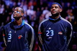 PHOENIX - FEBRUARY 15:  Dwyane Wade #3 and LeBron James #23 of the Eastern Conference stand during the National Anthem before the 58th NBA All-Star Game, part of 2009 NBA All-Star Weekend at US Airways Center on February 15, 2009 in Phoenix, Arizona.  NOTE TO USER: User expressly acknowledges and agrees that, by downloading and or using this photograph, User is consenting to the terms and conditions of the Getty Images License Agreement.  (Photo by Kevork Djansezian/Getty Images)