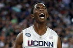 DETROIT - APRIL 04:  Hasheem Thabeet #34 of the Connecticut Huskies reacts after he scored a basket in the first half against the Michigan State Spartans during the National Semifinal game of the NCAA Division I Men's Basketball Championship at Ford Field on April 4, 2009 in Detroit, Michigan.  (Photo by Gregory Shamus/Getty Images)